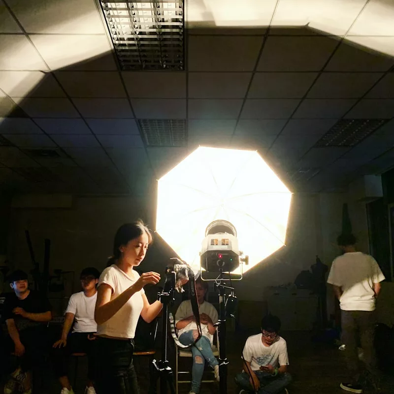 woman standing near the video camera